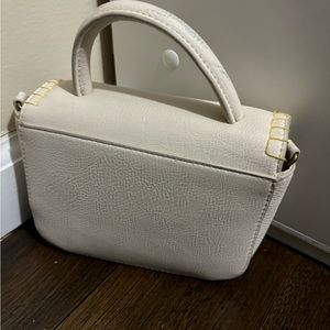 Small bag with handle and cross body straps